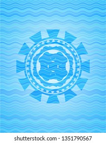 four leaf clover icon inside light blue water style emblem.