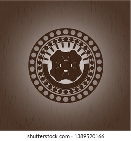 four leaf clover icon inside wood badge or emblem