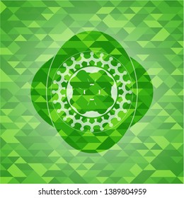 four leaf clover icon inside green emblem. Mosaic background