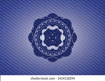 four leaf clover icon inside emblem with denim texture