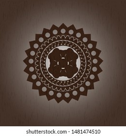 four leaf clover icon inside badge with wood background