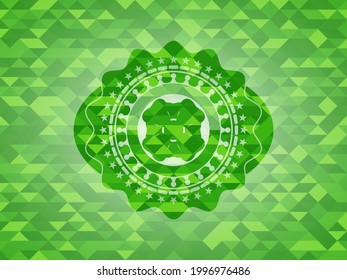 four leaf clover icon inside green emblem with mosaic background. 