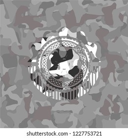four leaf clover icon on grey camouflage pattern