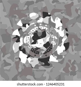 four leaf clover icon on grey camouflage texture
