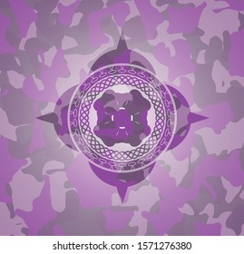 four leaf clover icon on pink and purple camouflaged pattern