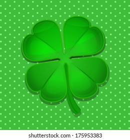 Four Leaf Clover on Green Polka Dot Background 