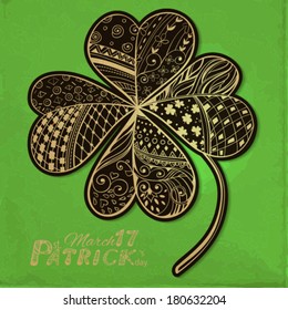 Four leaf ,Hand- drawn decorative clover filled with floral and geometrical patterns, St. Patrick's day card with old paper texture