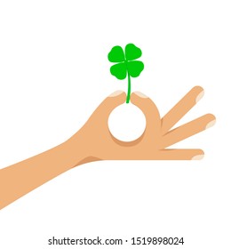 Four leaf lucky green clover held  in human hand. A traditional Irish symbol of St. Patrick. Flat style cartoon colorful concept vector illustration isolated on white background.