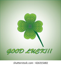four leaves clover with note good luck