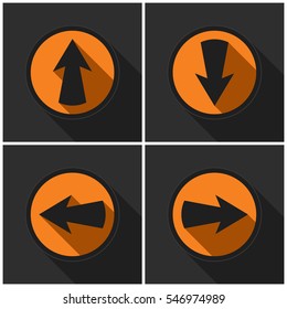 Four orange round - black arrows in four directions with shadows on a dark gray background.
