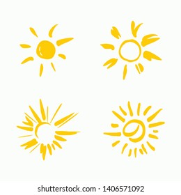 Four painted yellow suns. Vector solar symbols set.