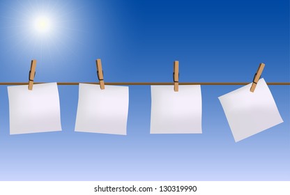 Four paper notes hanging on rope