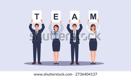 Four professionals in business attire stand together holding individual letters that spell out the word TEAM, symbolizing unity and collaboration.