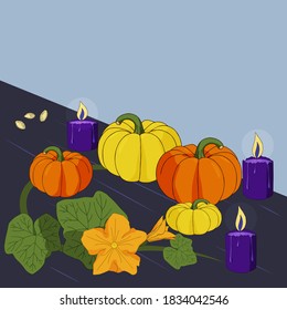cuatro calabazas sobre una mesa con velas