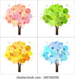Four seasons tree of paint splashes with colors for spring, summer, autumn, winter