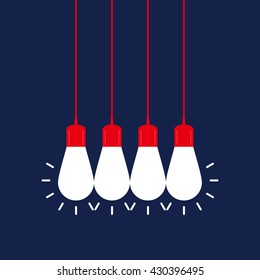 Four shining light bulbs on navy background