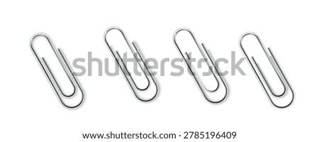 Four shiny metal paperclips arranged in a row on a clean white background