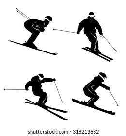 Four silhouettes of skiers