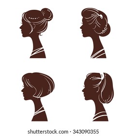 Four silhouettes of women's heads with beautiful stylized haircut