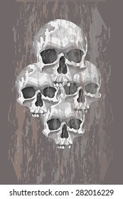 Four skulls on a gray background