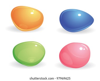 four small, smooth, shiny, differently colored  gems. blue, green, pink and yellow stones on a white background
