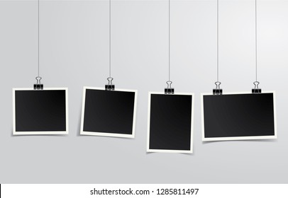 Four square vector photo frames hanging on metal clips. Vertical and horizontal template photo design	