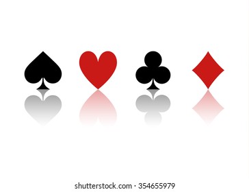 four suits of cards with reflection on a white background 