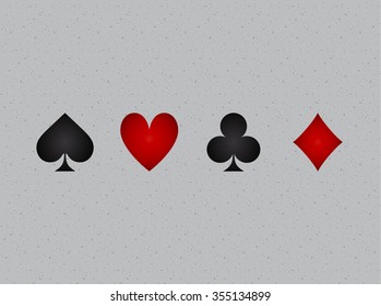 four suits of cards with shadow inside on a gray rough paper