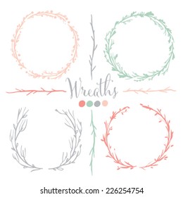 Four vector floral wreaths. Hand drawn design elements set.