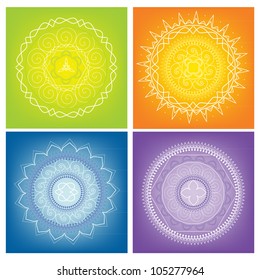 Four white mandalas on the colors background