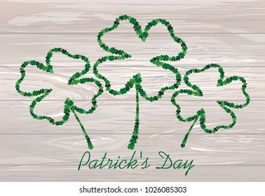 four-leaf. the contour of the clover.  St.Patrick 's Day. Vector illustration. Greeting card with empty space for text or advertising. On wooden background.