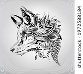 Fox head in floral ornament 