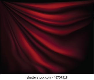 Fragment dark red stage curtain on a black background