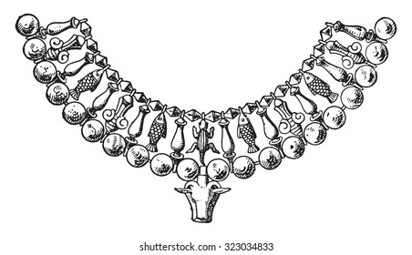 Fragment of Egyptian necklace with cow's head, vintage engraved illustration.
