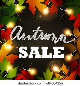 Frame of autumn leaves painted on black chalkboard