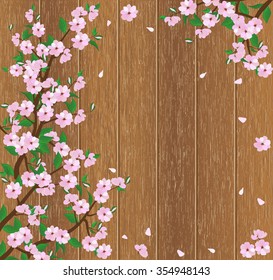 frame of blooming tree branch on a wooden background