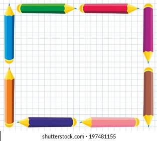frame of colored pencils on notebook sheet