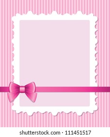 frame with glossy bow on pink striped background