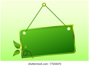 Frame hanging on a string with a green branch of leaves