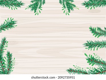frame made with pine branches for christmas and a wood texture at background