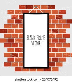 frame on a brick wall and the wooden floor