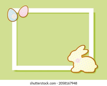 A frame on a yellow background with Easter gingerbread in the shape of an egg and a rabbit.
