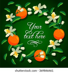 Frame of orange and blossoms of orange tree. Green background and place for your text