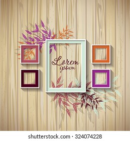 Frame template. Set of a frame on a wooden wall with leafs
