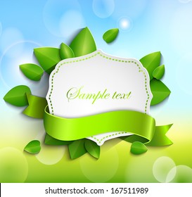 Frame for text in a vintage style with a ribbon against the background paper leaves and spring bokeh background