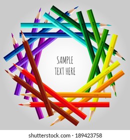 Frame of varicolored pencils with sample text
