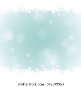 Frame for your text with white snowflake borders and snow light on the light green background