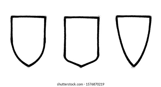 Frames in the shape of a shield. Abstract graphic spray paint frame. Vector illustration