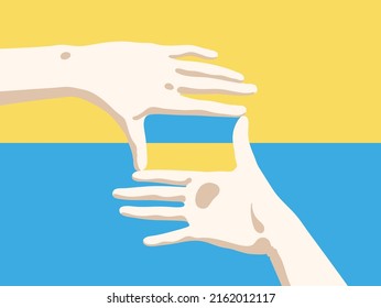 Framing hands. Ukrainian yellow blue flag in focus. Patriotic poster