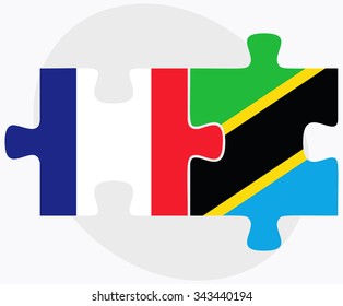 France and Tanzania Flags in puzzle isolated on white background